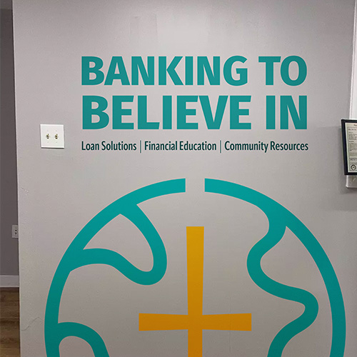 NCDCU's logo shown as a mural in its office
